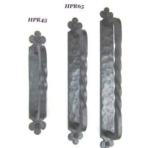 May include: Three black metal door pulls with a twisted design and a decorative flower-shaped top. The pulls are labeled HPR45, HPR65, and HPR85.