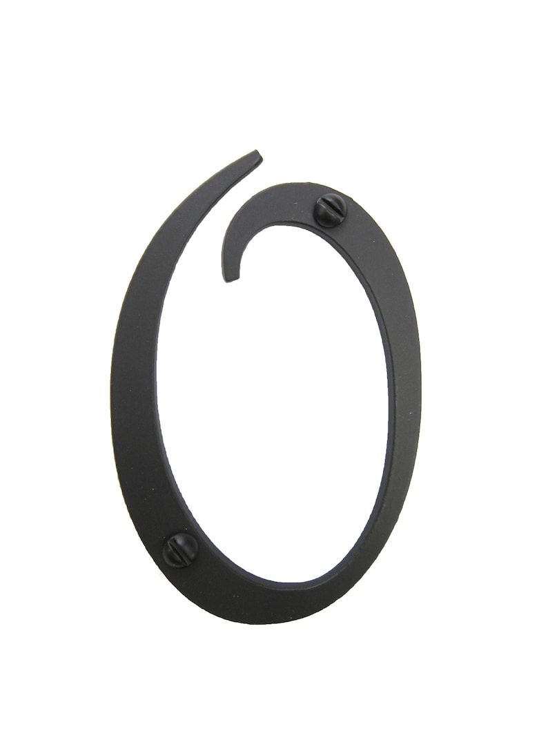 May include: Black metal house number zero with a curved design. The number is attached with two screws.