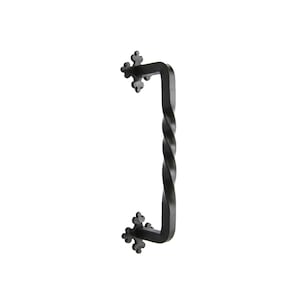 May include: Black wrought iron door pull with a twisted center and decorative floral accents at each end. The handle is a sturdy, rectangular shape, perfect for a rustic or vintage aesthetic.
