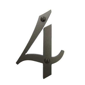 May include: A black metal house number four with a decorative, stylized font. The number is attached to a surface with two screws.