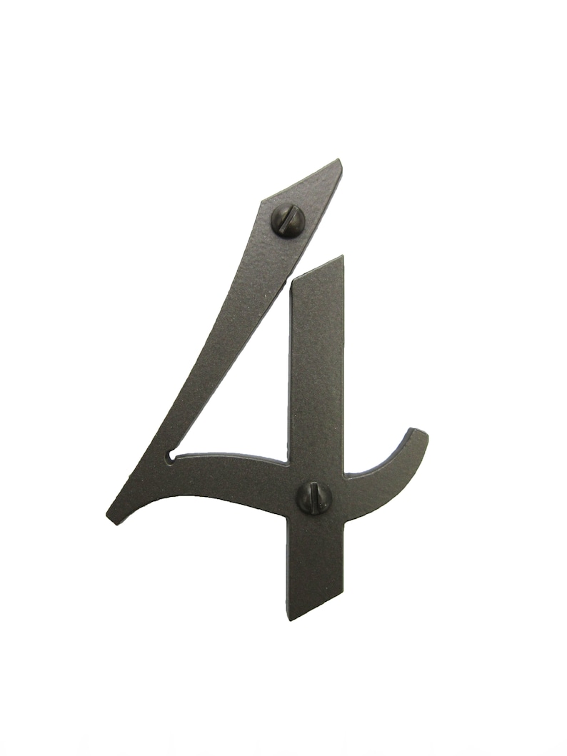 May include: A black metal house number four with a decorative, stylized font. The number is attached to a surface with two screws.