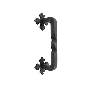 May include: Black metal door pull with a twisted design and decorative fleur-de-lis accents.
