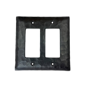 May include: Black metal double switch plate with a hammered finish.