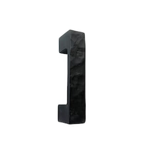 May include: Black metal door handle with a textured finish.
