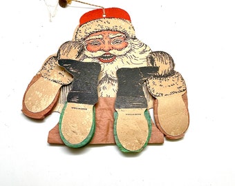 Papá Noel bailando con brazos y piernas de acordeón, década de