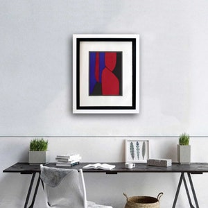 Puede incluir: Impresi&oacute;n de arte abstracto en un marco negro con un passe-partout blanco. La impresi&oacute;n presenta un dise&ntilde;o geom&eacute;trico rojo, azul y negro.