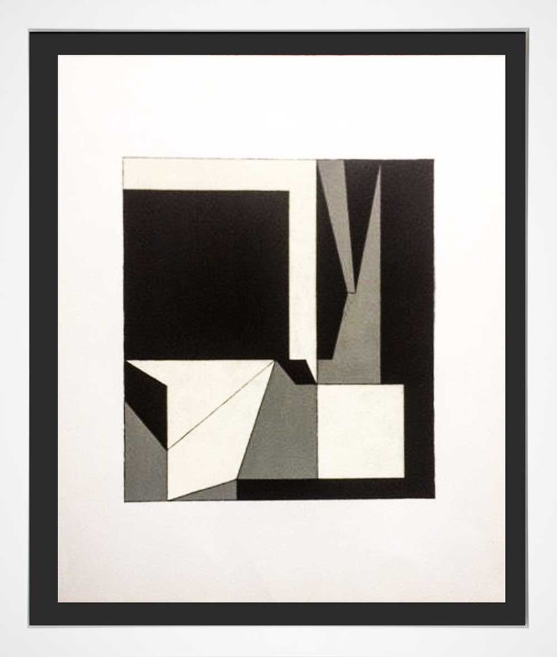 May include: Abstract geometric art print in a black frame. The artwork features a composition of black, white, and gray shapes, including squares, triangles, and rectangular forms. The design is minimalist and modern, with a focus on geometric shapes and contrasting colors.