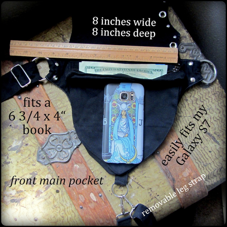 May include: Black canvas hip bag with a large front pocket, a removable leg strap, and a zippered pocket. The bag measures 8 inches wide and 8 inches deep. The text "fits a 6 3/4 x 4" book" and "easily fits my Galaxy S7" is printed on the bag.