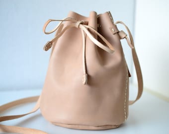 Leather draw string bag, hand stitched round sling bag, Body cross bag.