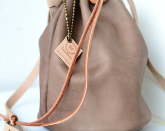 Leather draw string bag, hand stitched round sling bag, Body cross bag.