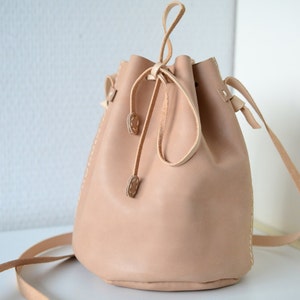 Leather draw string bag, hand stitched round sling bag, Body cross bag. image 5