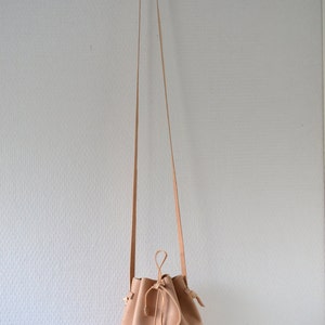 Leather draw string bag, hand stitched round sling bag, Body cross bag. image 4