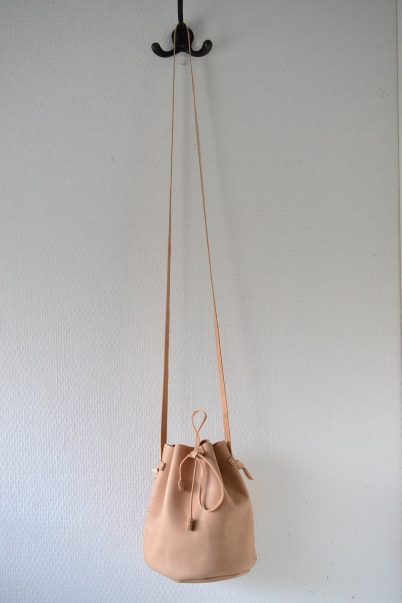 Leather draw string bag, hand stitched round sling bag, Body cross bag. image 4