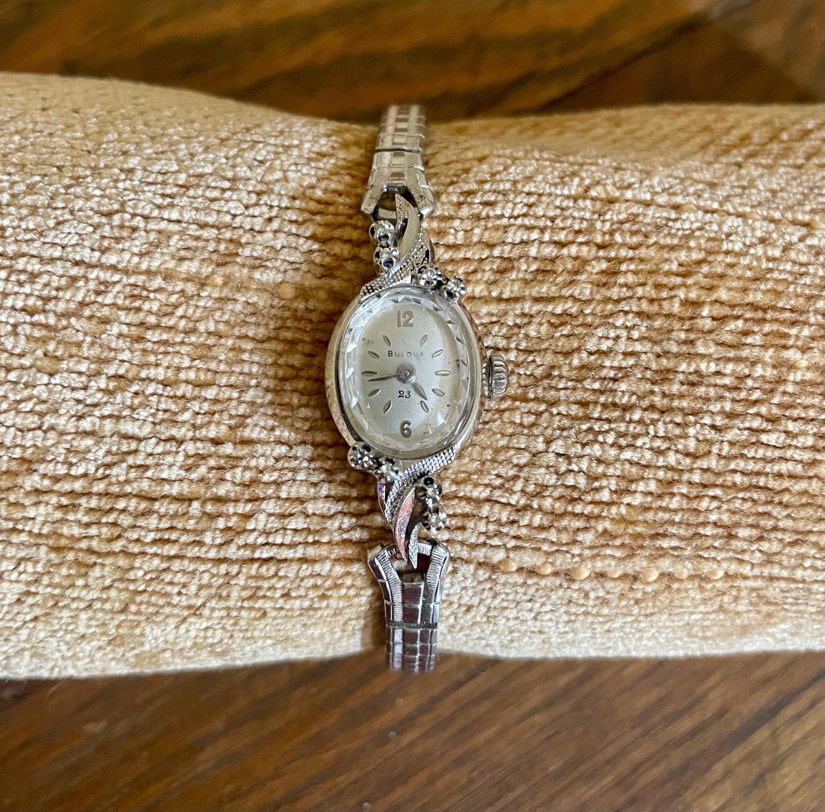 Vintage Ladies Bulova vintage wrist watch 14k white gold with 8 diamonds  nonworking 24 jewel movement oval shape and Speidel USA band
