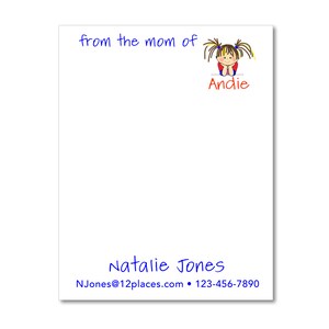 May include: White notepad with blue text that says "from the mom of" and a cartoon girl with brown hair and blue eyes. The girl is wearing a red shirt and has the name "Andie" written in orange below her. The bottom of the notepad has blue text that says "Natalie Jones" and "NJones@12places.com  123-456-7890"