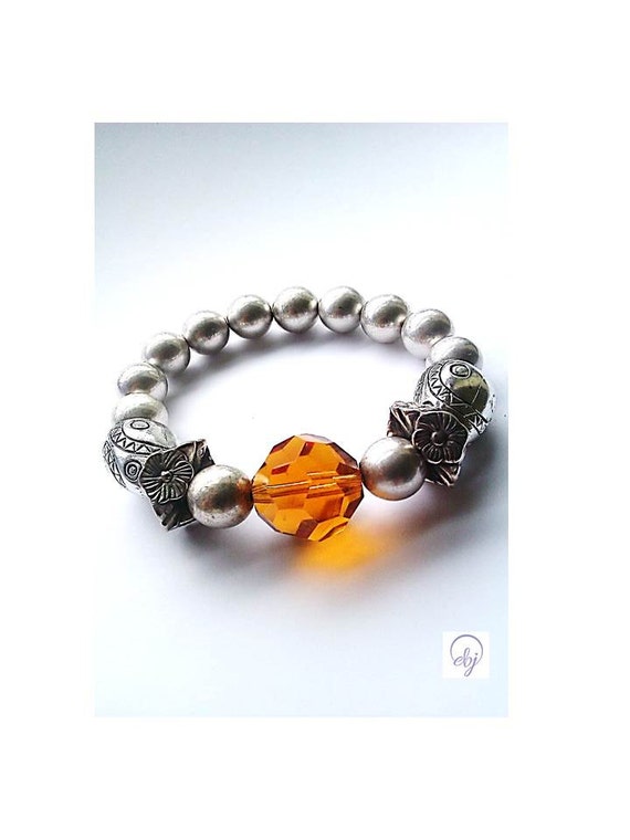 Items similar to Orange Crystal and Silver Plated Bead Stretch Bracelet