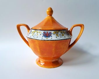 Azucarero de porcelana Beyer & Bock con tapa, color naranja con ribete negro (Alemania, década de 1930).
