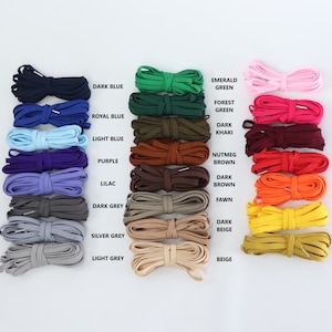 FLAT lacing for corsets with the ends finished with metal aglets colourchart - showing dark blue, royal blue, light blue,purple, lilac, dark grey, silver grey, light grey, emerald green, forest green, dark khaki, nutmeg brown, dark brown, fawn, beige