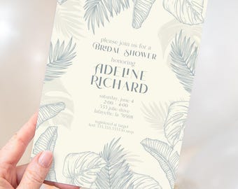 May include: A rectangular cream-colored bridal shower invitation featuring gray line-art illustrations of tropical palm and monstera leaves. The text reads: please join us for a BRIDAL SHOWER honoring ADELINE RICHARD, saturday, june 4, 2:00-4:00, 555 julie drive, lafayette, la 70508, registered at target, text 555.555.5555 to rsvp.