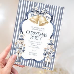 May include: Christmas party invitation with a blue and white striped background. The invitation features a decorative frame with gold bells and two nutcracker figures. Text includes "Christmas Party" and RSVP details.