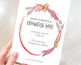 May include: A white invitation card with a red wine glass stain in the shape of a circle. The circle is decorated with watercolor illustrations of crawfish. The text on the card reads "you're invited to a crawfish boil!"  "saturday, april 6 11:00 am"  "555 julie lane lafayette, la 70508"  "rsvp to 555.555.5555"