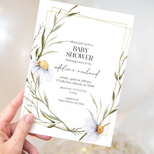 May include: A white baby shower invitation with a gold frame and watercolor floral design. The invitation reads "Please join us for a Baby Shower honoring mom-to-be Adeline Richard. Sunday, April 6 at 2:00 PM. 555 Julie Lane, Lafayette, LA 70508. Please text 555.555.5555 to RSVP. Registered at Target and Buy Buy Baby."