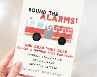 May include: An illustration of a red and grey fire engine with the text "Sound the Alarms!" and "And grab your gear Oliver is turning four this year!" The invitation includes the date, time, address, and RSVP information.