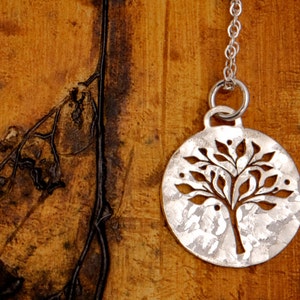 Silver Tree of Life Necklace - Round Sterling Silver Pendant with a pierced tree design.