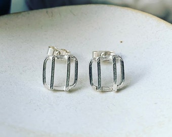 Square lines silver studs