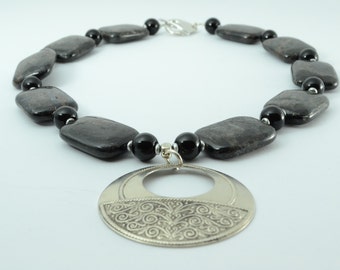 Black agate discs with Hill Tribe Silver discs and Antique Silver brass pendant