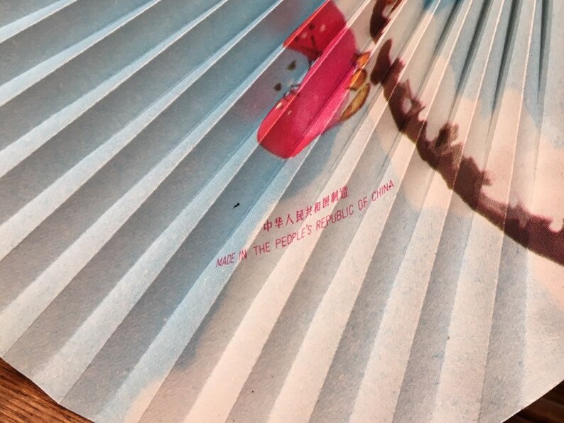Vintage oriental paper folding hand fan with cherry blossoms