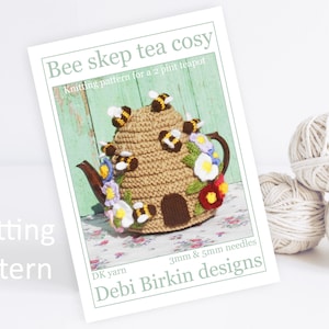 May include: Knitting pattern for a bee skep tea cosy. The pattern is for a 2-pint teapot and uses DK yarn and 3mm and 5mm needles. The pattern is by Debi Birkin Designs.