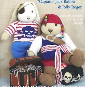 May include: Two knitted rabbit dolls dressed as pirates. One wears a red and white striped sweater with a skull and crossbones, the other a red headscarf with beads, a blue vest, and a belt. A small treasure chest filled with jewelry sits below.