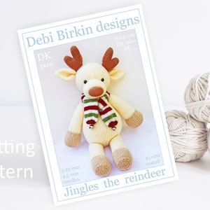 May include: Knitting pattern for Jingles the reindeer, a crocheted toy reindeer with a red and green striped scarf. The pattern is for a DK yarn and uses 3.25 mm and 4.5 mm needles. The finished reindeer is 43 cm tall when seated.