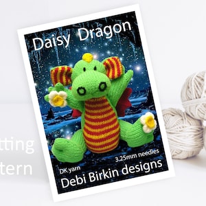 May include: Knitting pattern for a green and red striped Daisy Dragon with yellow flowers. The pattern is by Debi Birkin Designs and uses DK yarn and 3.25mm needles.