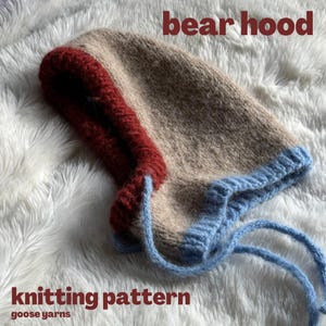 May include: Knitting pattern for a beige, red, and blue hooded hat with a drawstring. The pattern is called "bear hood" and is from "goose yarns".