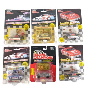 May include: Six different NASCAR Racing Champions collector cards featuring various drivers and cars. Each card includes a miniature die-cast car and a display stand.