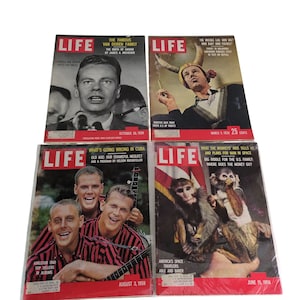 May include: Four vintage LIFE magazines. The covers feature various subjects, including a man speaking, a man with a horn, a musical group, and monkeys. The magazines are dated October 26, 1959, March 3, 1959, August 3, 1959, and June 15, 1959.