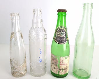 Set of 4 Vintage Glass Bottle Lot Clear Green Sun Crest RC Cola Champale 50s 60s