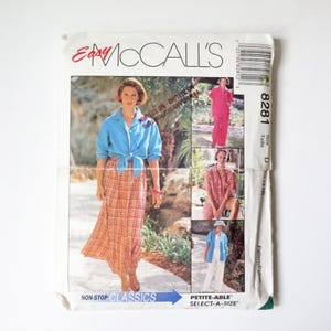 May include: An Easy McCall's 8281 sewing pattern envelope featuring illustrations of a button-down shirt, a long plaid skirt, and loose-fitting trousers. The cover displays text including Easy McCall's, 8281, and Select-A-Size, with a barcode.