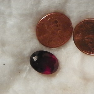 Hessonite Garnet 12.15 Carats 11.62x15.47x8.60 MM. Oval Silky Heavy Natural Inclusions Dark Orange Red Brown