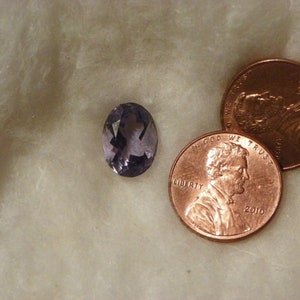 Blue Iolite 4.56 Carats 9.37x12.80x7.03 MM Oval Faceted Eye Clean Very Slight Natural Inclusions