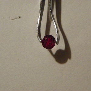 1.44 Carats Red Spinel 6.18x6.60x3.93 MM Oval Faceted Heavy Natural Inclusions
