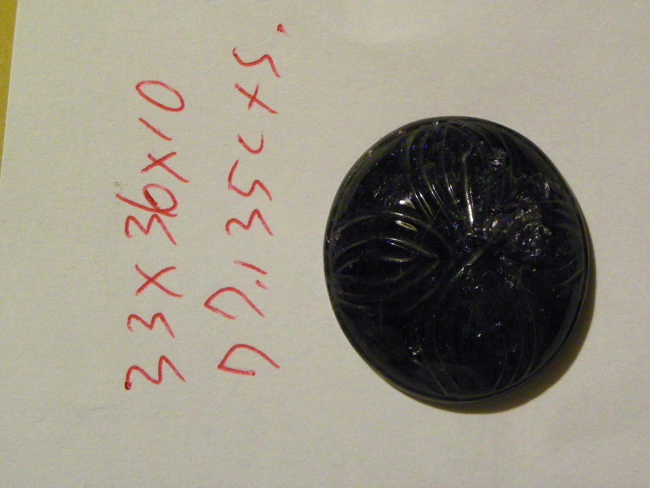 Carved Blue Iolite Cab 33x36x10 MM. Oval 77.135 Carats
