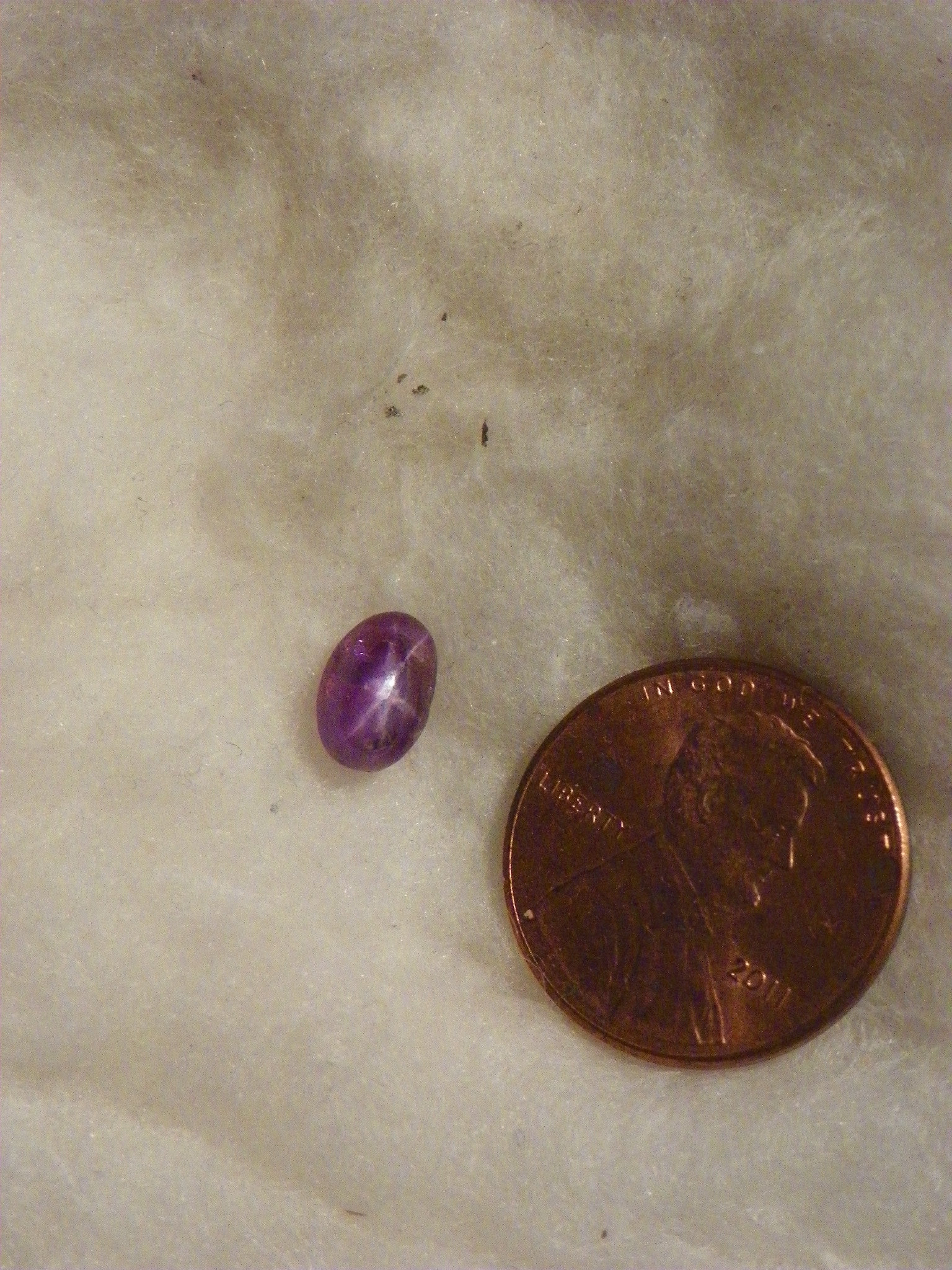 2.27 Cts Star Ruby 5.27x7.82x5.00 MM Oval Cab Purple Transparent Heavy Natural Flaws