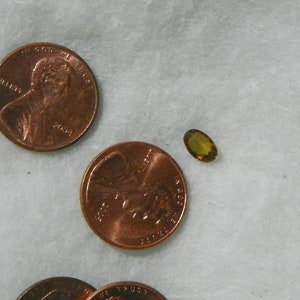 0.80 Cts Sphene 4.7 x 6.8 x 2.8 MM Oval Faceted Eye Clean Yellow Brown