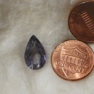 3.95 Carats Blue Iolite 9.54x15.49x6.01 MM Pear Faceted Eye Clean Slight Natural Inclusions