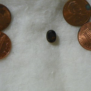 2.45 Cts Kornerupine 7x9 MM Oval Faceted 6.8x8.7x5.3 MM Slightly Included Brown