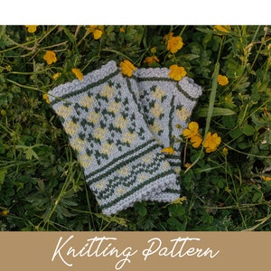May include: Knitting pattern for a pair of fingerless gloves with a green and yellow floral design. The gloves are laid out on a bed of green leaves and yellow flowers.
