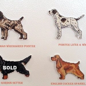 May include: Four embroidered dog breed patches, including a German Wirehaired Pointer, a Pointer Liver & White, a Gordon Setter, and an English Cocker Spaniel Red. The Gordon Setter patch has the word "SOLD" written on it.